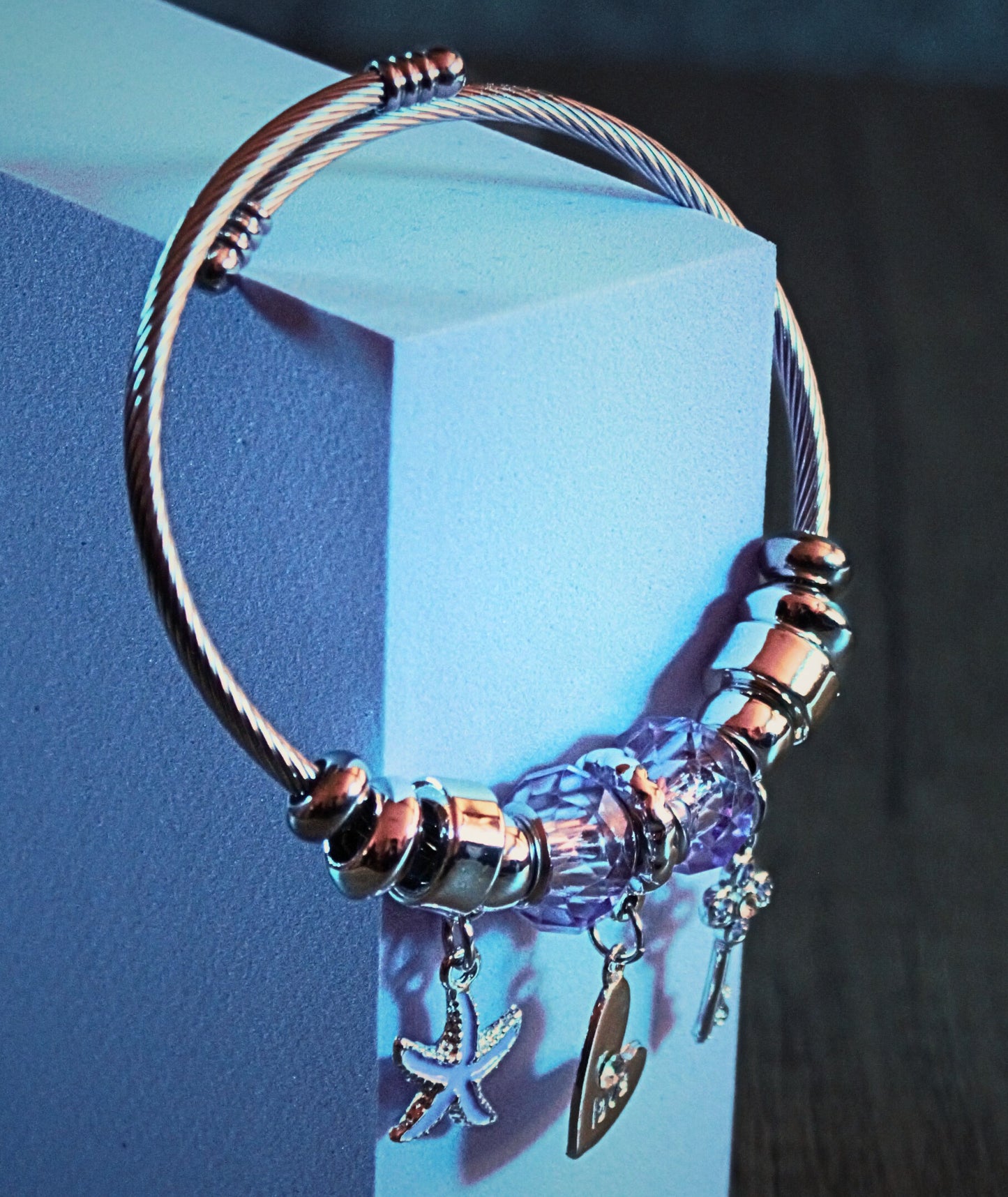 Pale, polished beaded bracelet featuring a lotus charm, embodying calm and spiritual clarity – Serene Glow by Charmed Curations.