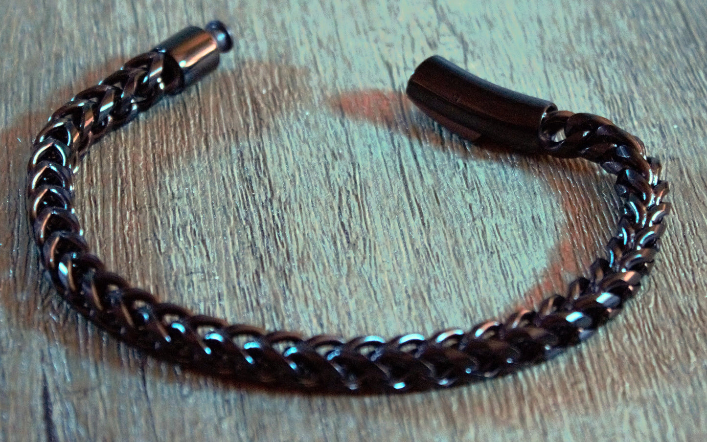 Gunmetal lobster clasp with dark chain links and charcoal bead detail